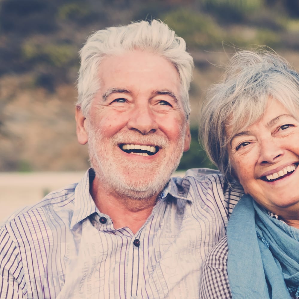 an older man and women with perfect smiles - Lake Hill Dental Care